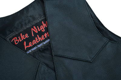 Close-up of a black leather vest, featuring a black satin liner and heavy-duty snaps, displays a label that reads "Daniel Smart Toddler Traditional Style Plain Side Vest" in red and white stitching.