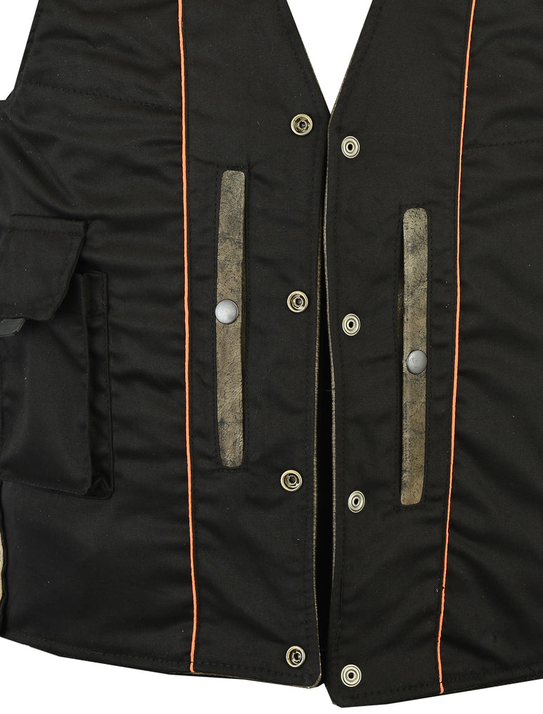 A close-up of the Daniel Smart Men's Antique Brown Single Back Panel Concealed Carry Vest highlights its black base adorned with orange piping and silver snap buttons. This stylish men's brown leather motorcycle vest is equipped with two vertical pockets featuring gray accents and a horizontal pocket on the left side, combining both style and function for the open road.