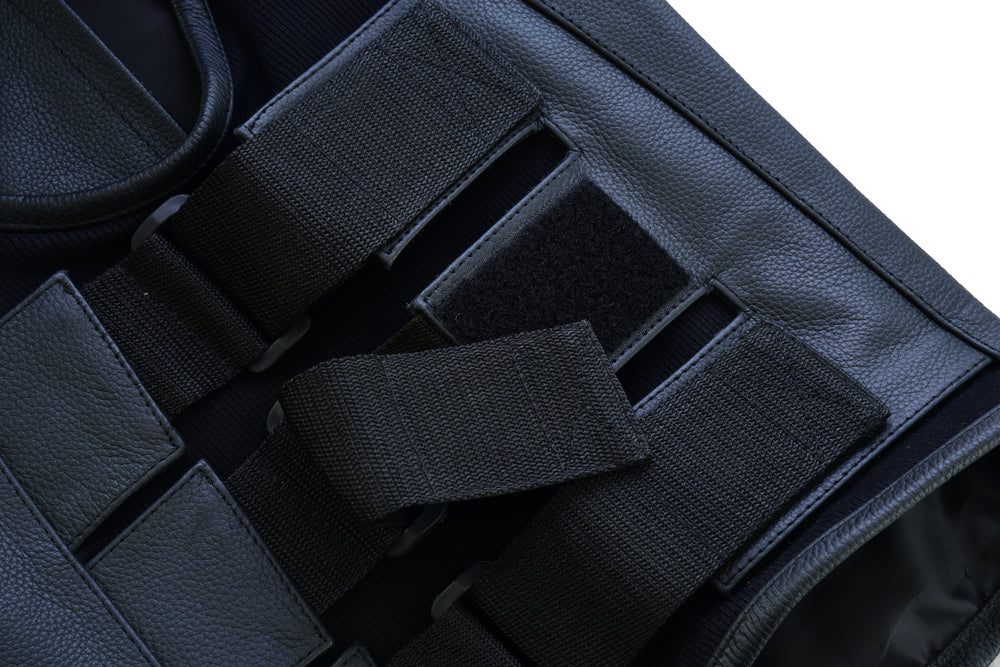 Close-up of a Daniel Smart Men's Updated SWAT Team Style Vest featuring velcro straps, concealed carry pockets, and durable fabric, isolated on a white background.