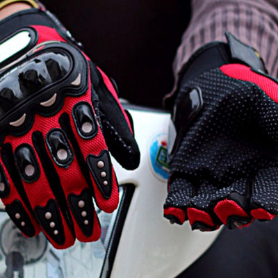 A pair of Alr™ Pro-Biker Series Waterproof Motorcycle Gloves on a motorcycle.