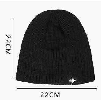 A Knitted Winter Beanie Hat featuring a snowflake, made of soft and warm material.
