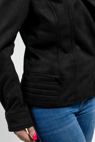 A woman wearing a First Manufacturing Molly - Women's Leather Jacket with horizontal zipper pockets.