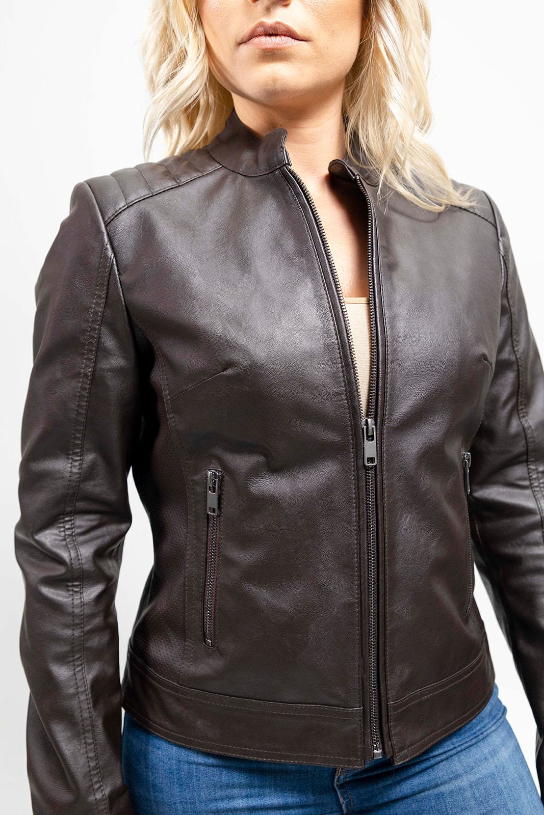 A woman wearing the First Manufacturing Beverly - Women's Vegan Leather Jacket, Brown.