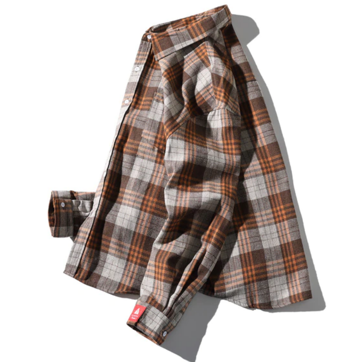 A long-sleeve, button-up Men's Classic Plaid Flannel Shirt, Yellow in shades of brown, orange, and gray lies flat against a white background. This American Legend Ride flannel is extra thick and cozy, perfect for chilly days.